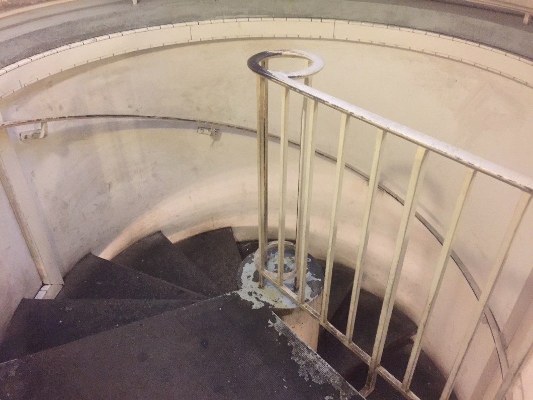 Spiral staircase that leads down from the street level to the catacombs below